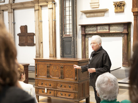 Patricia Kane, curator of American Decorative Arts, leads a tour in the Hume Furniture Study at West Campus