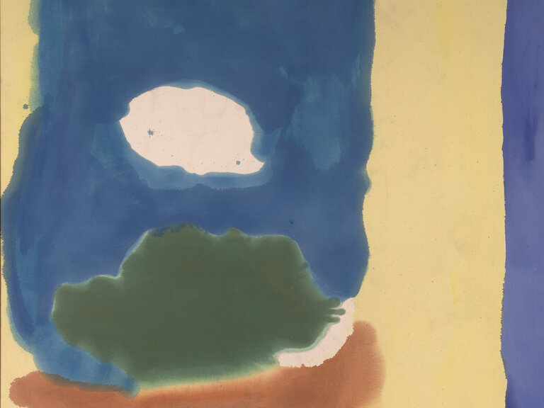 A painting characterized by washes of color against a largely yellow ground. A blue form runs along the entire right edge. From center to top left, washes of orange, brown, green, and blue are stacked on top of one another, forming a vertical, oblong mass. 