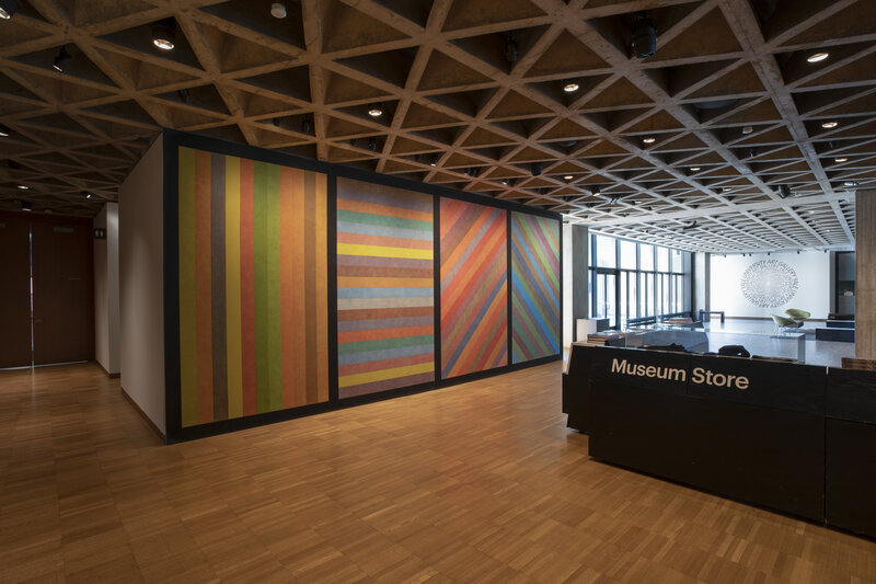 View of a colorful striped wall in a lobby space